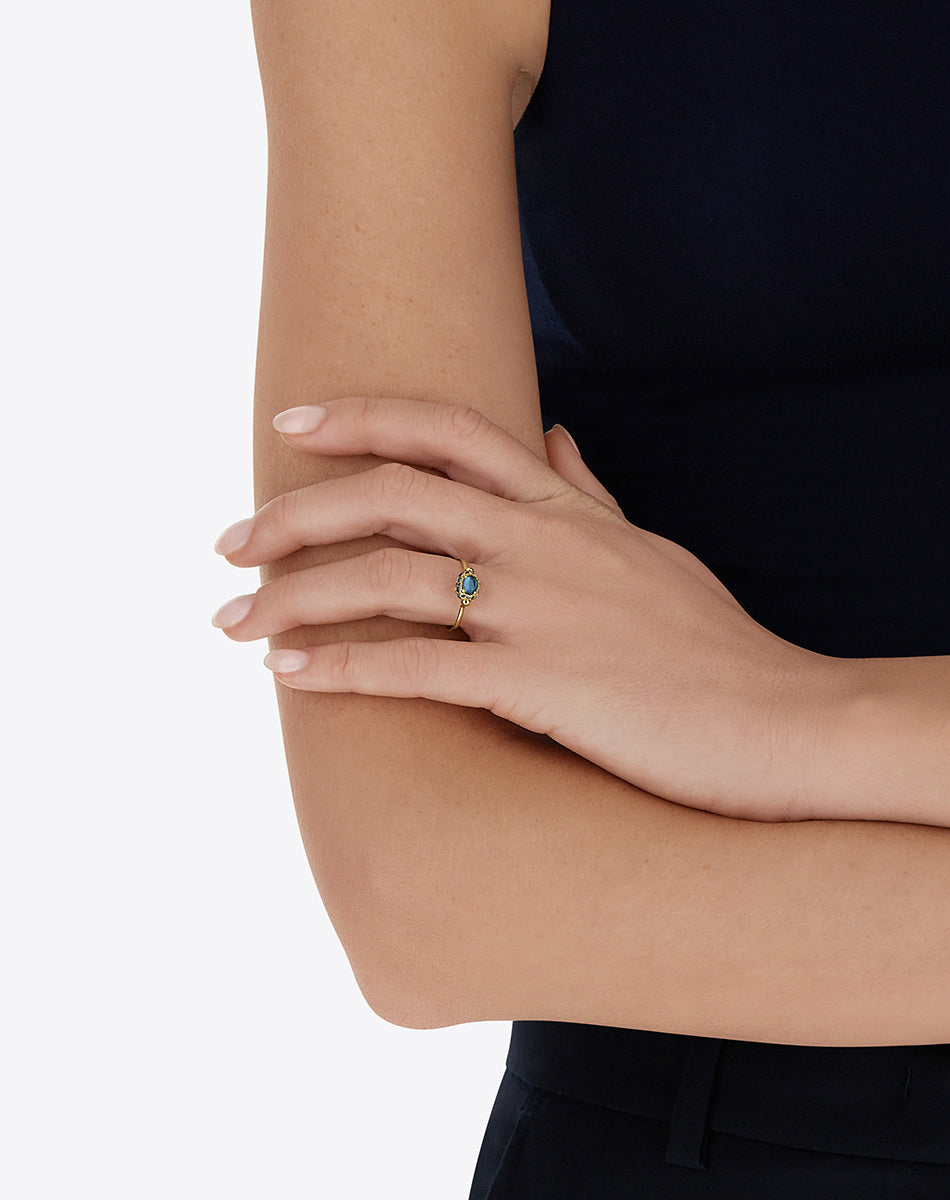 Double-sided “Reverse Baby” gold ring with blue diamonds, Swiss light blue topaz, green sapphires and London blue topaz