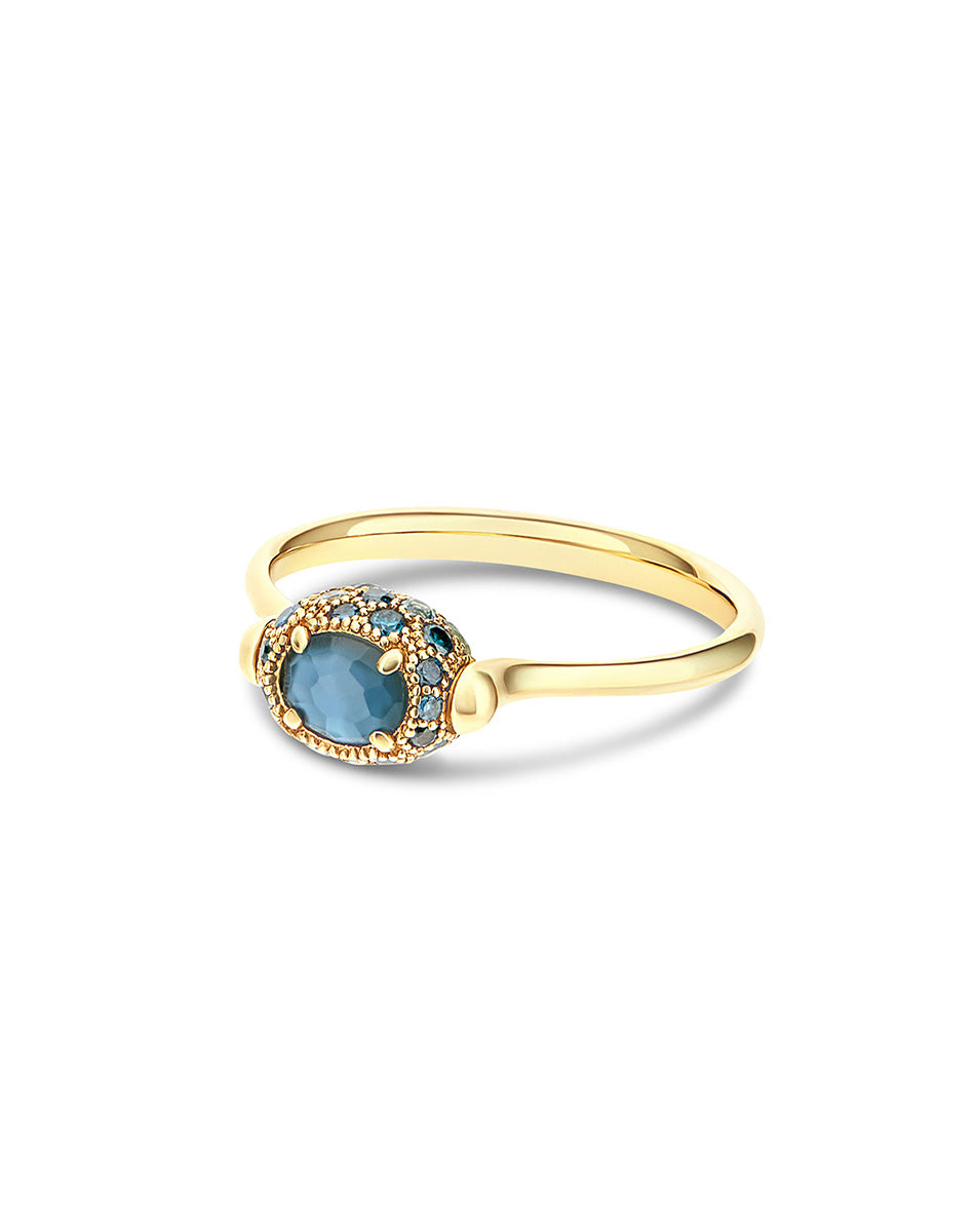 Double-sided “Reverse Baby” gold ring with blue diamonds, Swiss light blue topaz, green sapphires and London blue topaz
